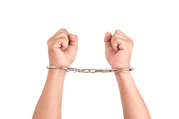 Close up hands with silver handcuffs isolated on white