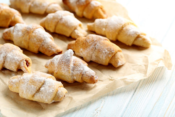 Fresh homemade croissants on a blue wooden table