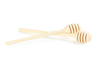 Wooden honey dipper isolated on a white