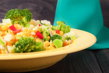 raw vegetable mix on the yellow plate