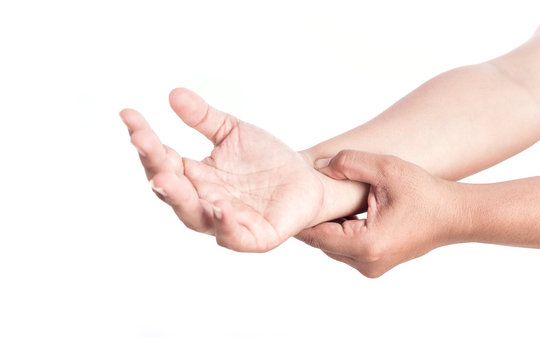 Close up woman's hand holding her wrist isolated on white . Elbo