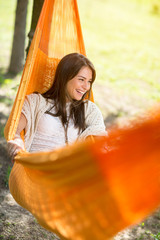 Woman lying and enjoying in hammock