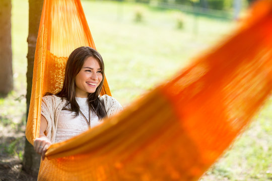 Female lying down in hammock and rest.