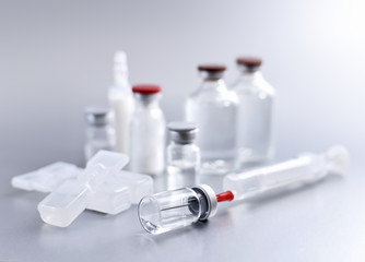 Vaccination equipment. Syringe and vials, studio shot. 