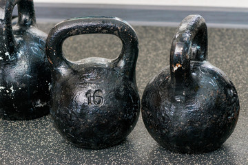 Fototapeta na wymiar Round heavy weights on the floor in the gym closeup