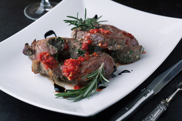 Beef roulade with smoked bacon grilled with rosemary and garlic