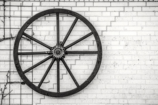 Old wheel hanging on a wall