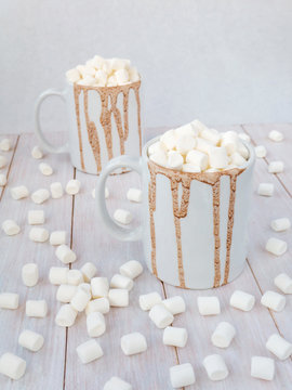 Hot chocolate in white mugs with drops