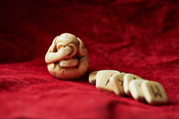 Rune on a background of red rough suede mint