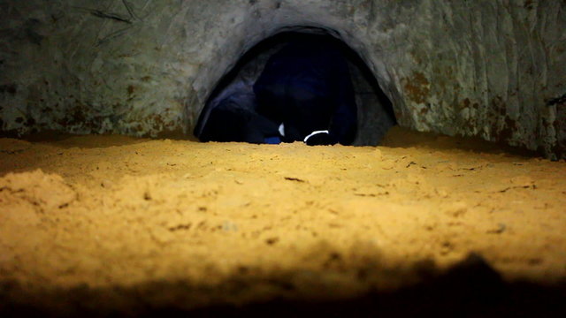 Cavers go in old adit for extraction of sand
