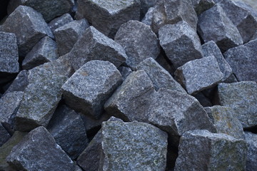 Heap of gray cobbles prepared on the construction site 