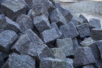 Heap of gray cobbles prepared on the construction site 