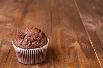 muffin chocolate on dark wood table