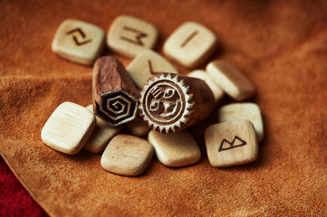 Rune on a background of brown rough suede mint