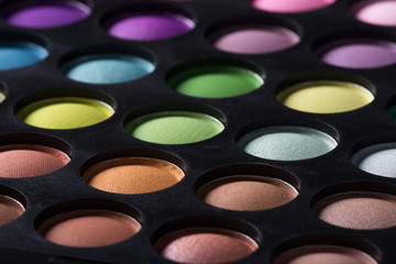Palette of colorful eye shadows.