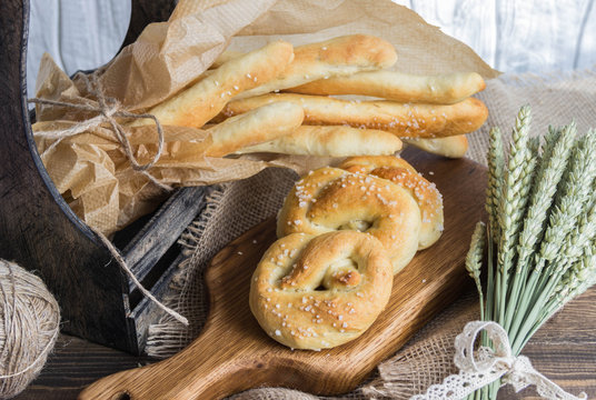 Tasty breadsticks grissini. Food on wooden background