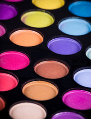 Palette of colorful eye shadows.