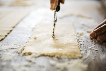 Making ravioli on a wooden table and tools