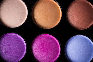 Palette of colorful eye shadows.