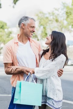 Happy couple with shopping bags