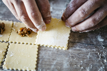 Making ravioli on a wooden table and tools - obrazy, fototapety, plakaty