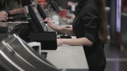 Cash register in the shop. Employees and buyers