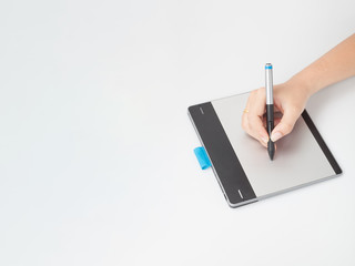 graphic designer hands writing on digital tablet with copy space for graphic design or website