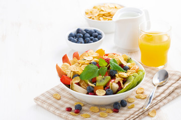 breakfast with fruit and berry salad, juice and cereal