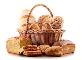 Wicker basket with assorted baking products isolated on white