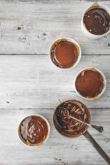 Chocolate dough for fondant in the ramekin vertical