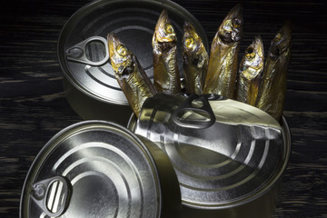 Close-up of Tinned capelin fish on wooden background