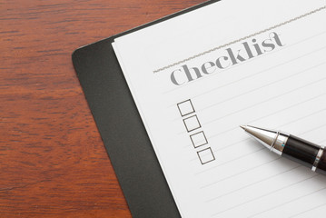 Concept : pen on book with checklist box with wood background - Checklist