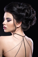 Beautiful brunette girl with arabic evening make-up and perfect skin. Beauty face. Close up