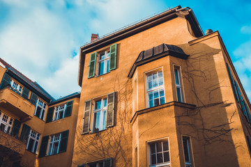 Cute brown apartments with bay windows in winter