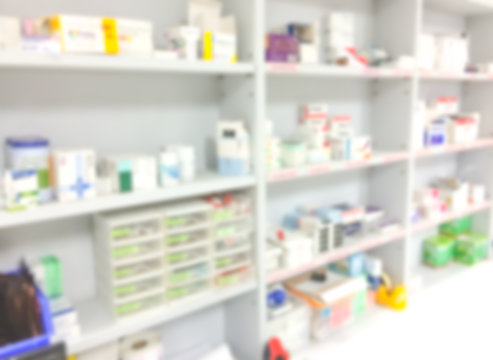 blur background drug shelves in drug store.