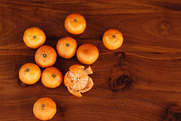 Ripe tangerines on wooden background. Mandarine oranges on woode