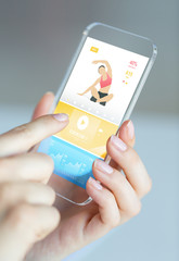 close up of hand with sport app on smartphone