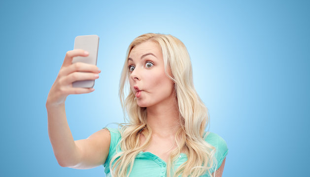 Funny Young Woman Taking Selfie With Smartphone