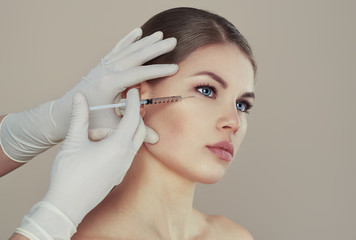 Caucasian female having cosmetic injection with collagen - 106697046