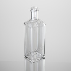 Glass bottle on white background