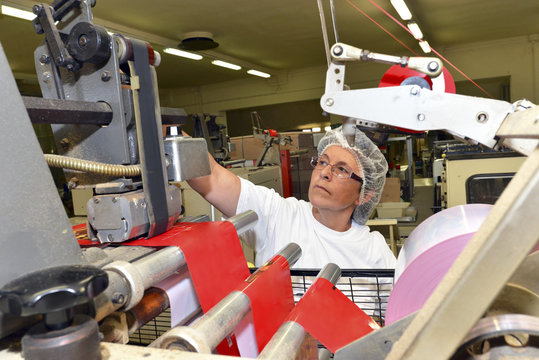 Germany, Saxony-Anhalt, portrait of female worker in a baking factory