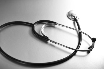 Medical equipment, stethoscope on a toned background. 
