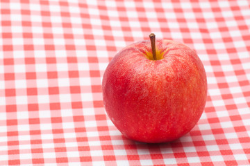 Red apple on table napkin