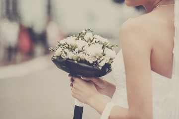 Young bride  holding bridal bouquet.