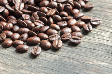 selective focus coffee bean on wood background.
