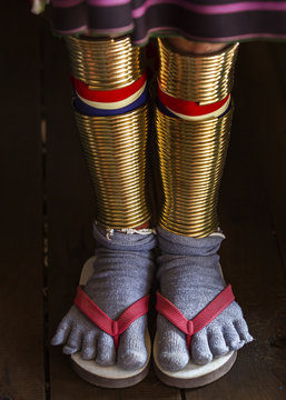 Padaung Tribe's Woman wearing golden rings around legs
