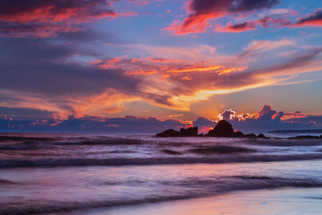 Fototapeta na wymiar Fiery sunset at sea. Gale beach.