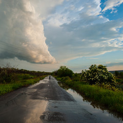 Fototapeta na wymiar old road and the rain clouds