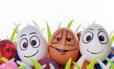 funny easter eggs / Three funny easter eggs in a easter basket