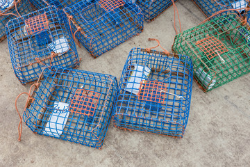 Many octopus traps stacked at port